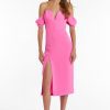 Girl in hot pink off the shoulder midi dress, front facing.