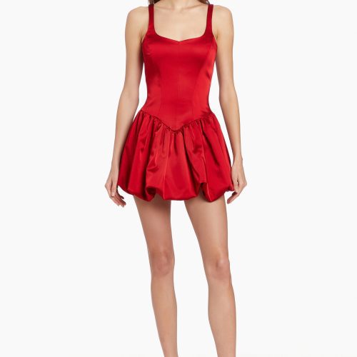 Girl in red dress with bubble hem, front facing.