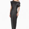 Girl in silk one shoulder black maxi dress, front facing.