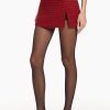 Red houndstooth mini skirt with slit.